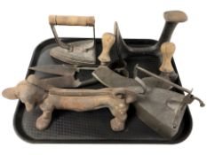 A group of 19th century irons, a cobbler's last, double handled bread knife, pair of antique shears,