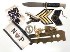 A small quantity of militaria including rank badges, a British Army brass button polisher,