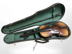 A child's three quarter size violin in coffin case with bow.