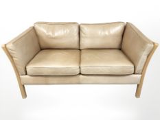 A late 20th century Danish tan leather two seater settee,