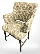 A mid 20th century floral upholstered armchair