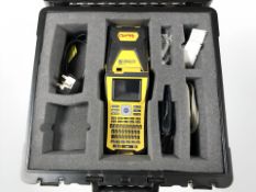 A Brady BMP61 label printer, boxed with leads and instructions.