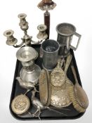 A group of pewter tankards and candlestick, EPNS candlesticks, dressing table brushes,