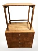A teak four drawer low chest,
