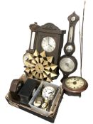 A group of wall and mantle clocks, two carved oak barometers, etc.