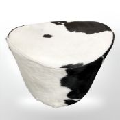 A cow hide stool,