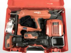 A Hilti BX 3 nail gun, boxed with accessories.