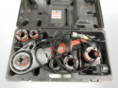 A Ridgid 690-1 handheld pipe threading tool, boxed.