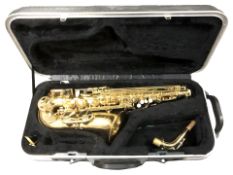 An Elkhart Series II saxophone, with mouthpiece and travel case.