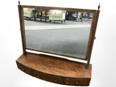 A mahogany bow front dressing table mirror, width 69 cm.