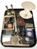 A group of brass door furniture, ring sizer, metal wares, treen,