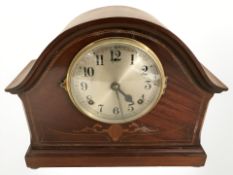 An Edwardian mahogany and satinwood inlaid eight day mantle clock, width 34 cm.