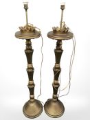 A pair of gilt wood floor lamps,