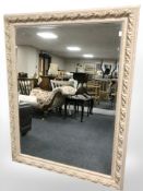 A reproduction bevelled over mantel mirror with gilt highlights,