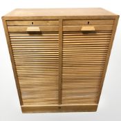 An early 20th century continental tambour front office filing chest, 86 cm x 40 cm x 107 cm.