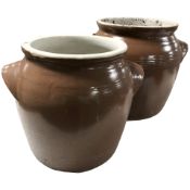 Two glazed stoneware twin handled pots, tallest 29 cm.