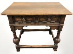 An early 20th century oak two drawer side table,