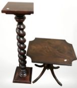 A reproduction torchere and a mahogany occasional table.