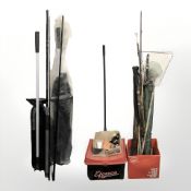 A group of vintage and modern fishing rods, nets, Fladen reel, fishing line,