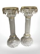 A pair of early 20th century twist glass candlesticks with beaded tassels, height 37 cm.