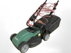 A Qualcast electric lawn mower.