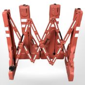 Three plastic extendable hazard barriers,