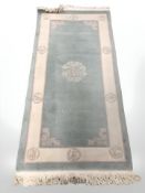 A Chinese runner on pale green ground,