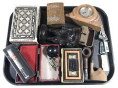 A group of pipes, cigar cutter, lighter, carved oak mantle clock, African carved figure group,