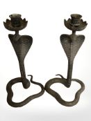 A pair of Indian brass cobra candlesticks, height 30 cm.