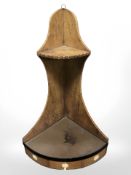 A beech bow front corner wall cabinet, height 68 cm.