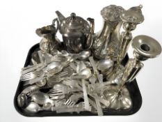 A large quantity of EPNS cutlery, tea pots, pair of candlesticks, etc.