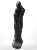 A continental hollow cast pottery abstract sculpture of a couple embracing, height 58 cm.