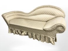 An early 20th century chaise longue in striped floral cream and gold fabric,