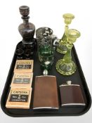 A pair of uranium glass candlesticks, height 20 cm, two reproduction hip flasks,