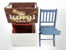 Three painted pine bottle crates and a small child's folding chair