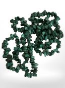 A polished malachite necklace, length approximately 80 cm.