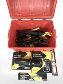 A plastic tool box containing Tooltech cordless drill,