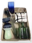 A group of studio glass including a bottle in the shape of a kukri knife,