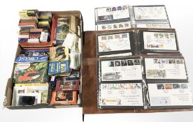 Three albums of first day covers, playing cards, collector's cards and booklets,