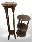 A reproduction mahogany jardiniere stand and a further three tier stand.