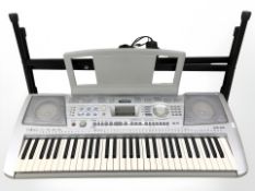 A Yamaha PSR 290 digital keyboard on stand