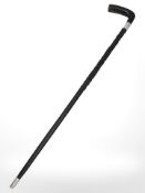 An Irish carved and ebonised wood walking stick decorated with clovers, length 82 cm.