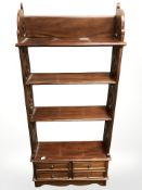 A reproduction mahogany open bookcase, width 49 cm.