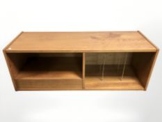 A 20th century teak low record cabinet, 122 cm x 44 cm x 49 cm.