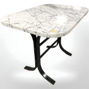 A marble topped table on painted metal support,