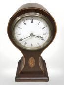 An Edwardian mahogany and satinwood inlaid balloon mantle time piece,