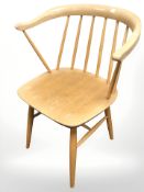 An Ercol elm and beech stick back armchair.
