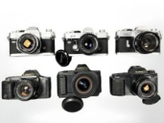 A collection of 35mm SLR cameras to include Canon T80 with Canon zoom lens AC 35-70mm 1: 3.5-4.