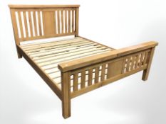 A contemporary oak 5' bed frame, overall 220 cm long x 162 cm wide,