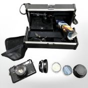 A Yashica camera carry case containing Yashica Electro 35 35mm camera with Color-Yashinon DX 1:1.